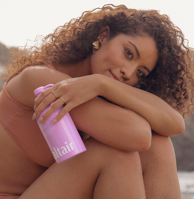 model holding island orchid body wash